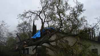 Devastating storm damage to single story residence